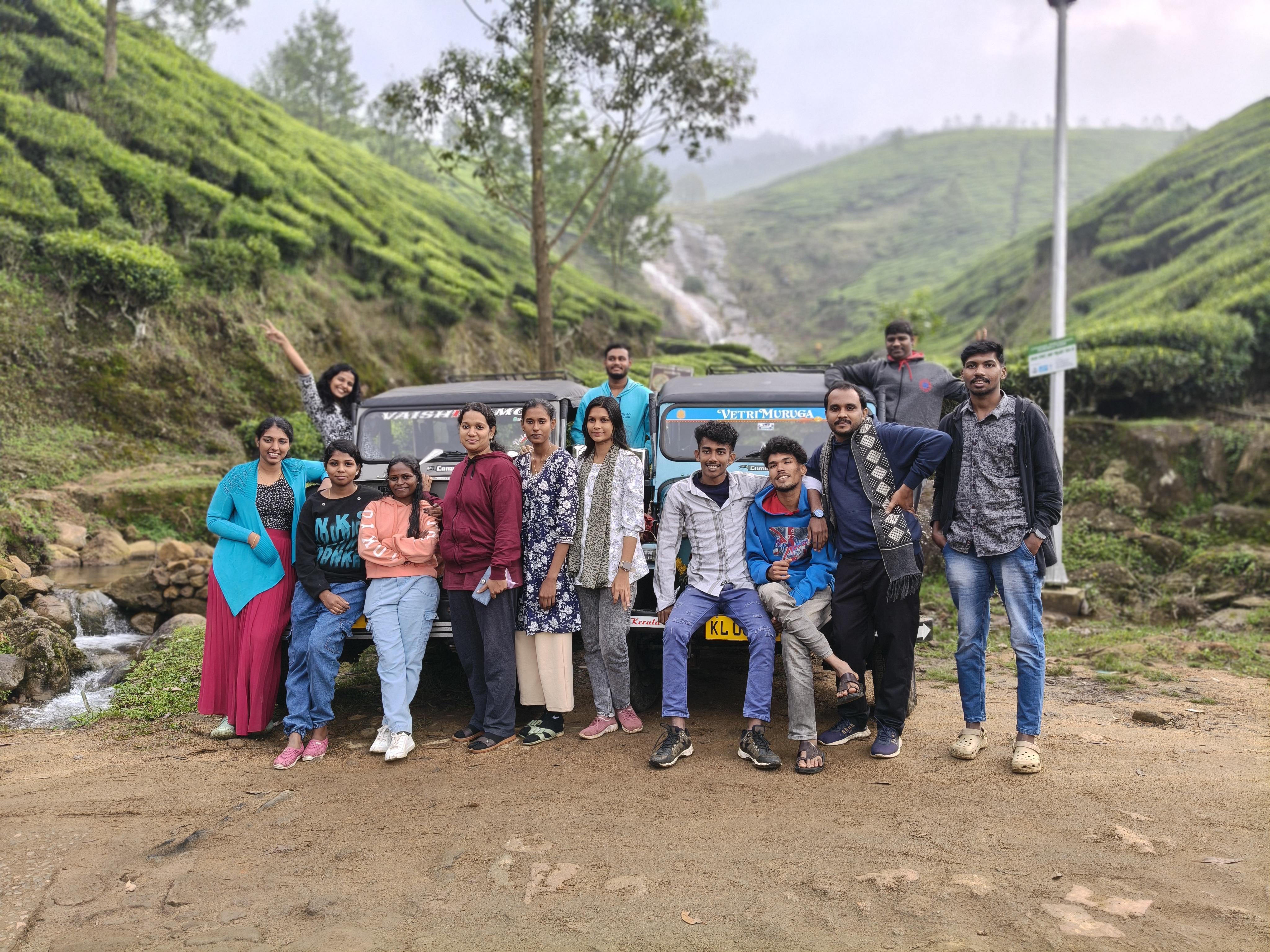 Kolukkumalai Sunrise Point trekking viewpoint with mist-covered mountains and tea estates